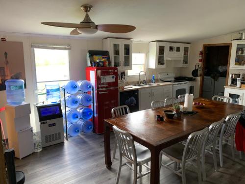 a kitchen with a dining table and a red refrigerator at Rocket Ranch #1 - Mars in Brownsville