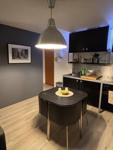 a kitchen with a table with a plate on it at Studio 33, centre-ville, proche gare in Annecy