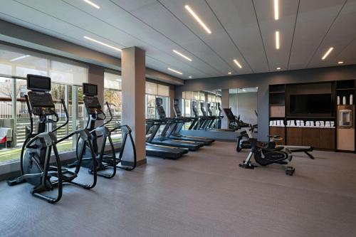 a gym with treadmills and ellipticals in a building at TownePlace Suites by Marriott Albuquerque Uptown in Albuquerque