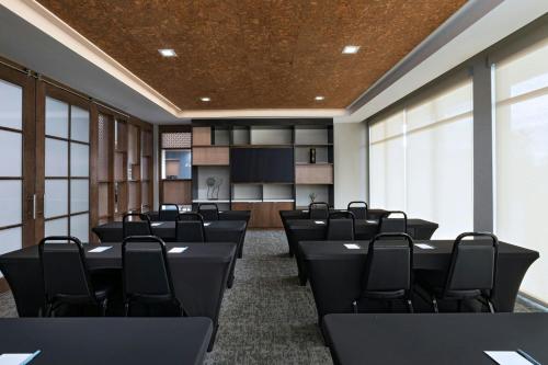 a conference room with black tables and chairs at TownePlace Suites by Marriott Albuquerque Uptown in Albuquerque