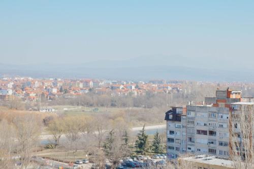 a view of a city with a tall building at Premium Planet Deluxe in Niš