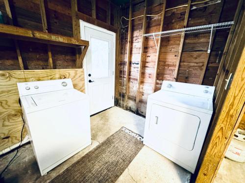 a laundry room with a washer and dryer at Relax & Unwind in 2BR 1BA Home in Quiet Neighborhood in Nederland