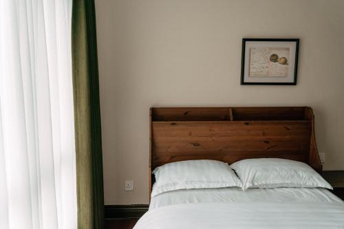 Ένα ή περισσότερα κρεβάτια σε δωμάτιο στο Gee homestay