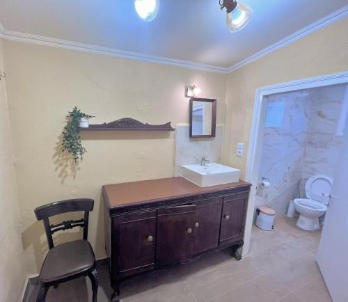 a bathroom with a sink and a toilet at The Beach house in Platanitis Rodopis