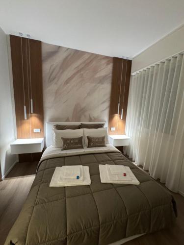 Postel nebo postele na pokoji v ubytování B&B IV Novembre