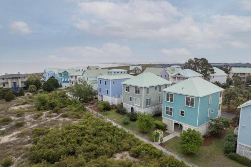an aerial view of a row of houses at Rolling Tide - Short Walk to the Beach in Cedar Reef Villas