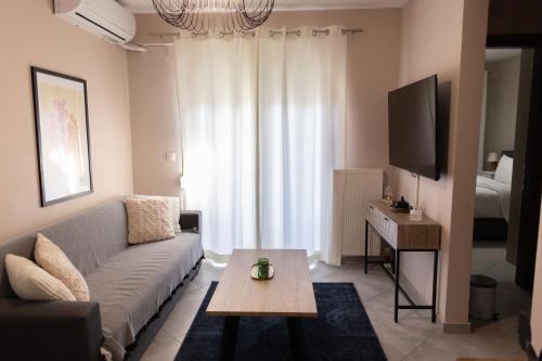 a living room with a couch and a table at Santa Marina 6 in Ioannina