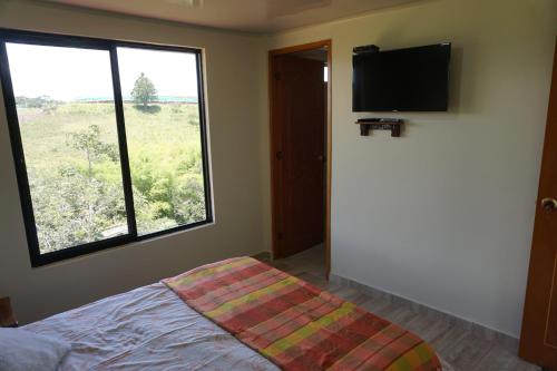 Postel nebo postele na pokoji v ubytování Campo y Descanso 15 min Ciudad Apto 01