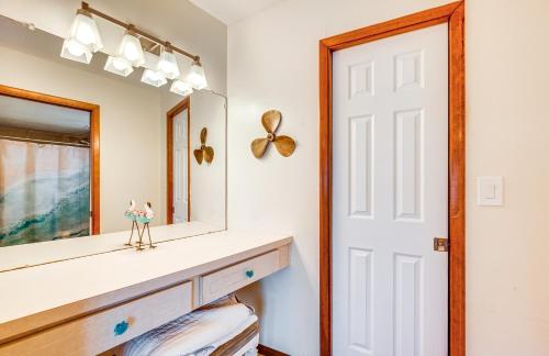 a bathroom with a mirror and a dresser at Waterfront Florida Escape with Deck and Private Dock! in Hernando Beach