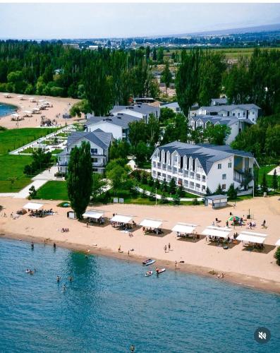an aerial view of a beach and buildings at Harmony Lake House in Chon-Sary-Oy