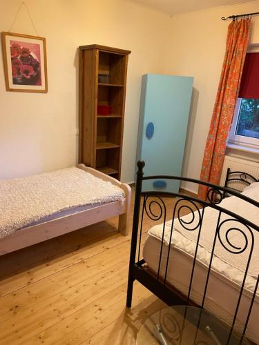 a bedroom with a bed and a book shelf at Kiel Leuchtturm in Kiel