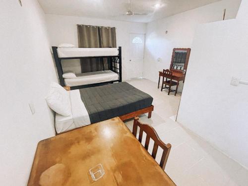Ένα ή περισσότερα κρεβάτια σε δωμάτιο στο Che Bacalar Hostel & Bar Adults Only