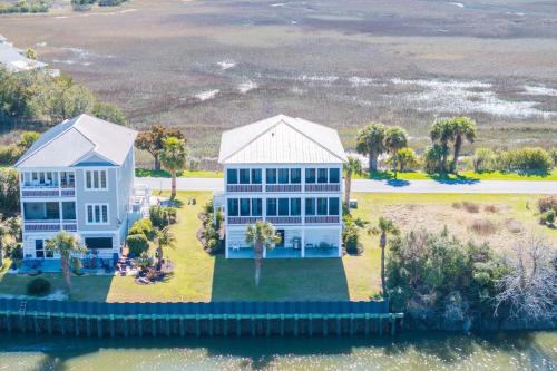 an aerial view of a large white house at Buried Treasure - Great Marsh Views on Harbor! in Nautical Watch Villas