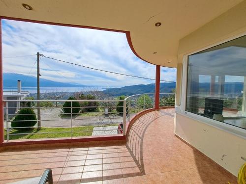 a balcony of a house with a view at Up on the hill in Nafpaktos