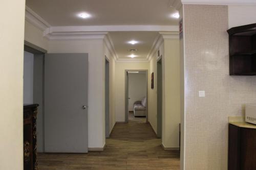 a hallway with a hallway leading to a room at Sea Club Resort in Dammam