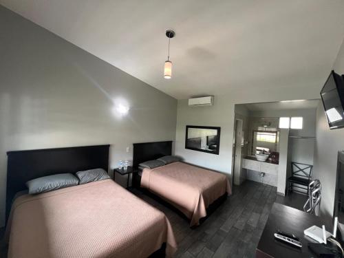 Postel nebo postele na pokoji v ubytování Hotel Luna Park