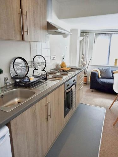 a kitchen with a sink and a counter top at The Hanham Retreat in Bristol