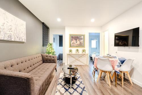 a living room with a couch and a table at Bright stay in Griffin Town in Montréal