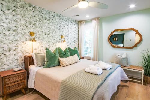 a bedroom with a bed with two towels on it at Nature’s Haven in Kiawah Island