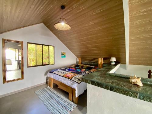 a bedroom with a bed and a tub in a room at Casa Veronica in Italcancori
