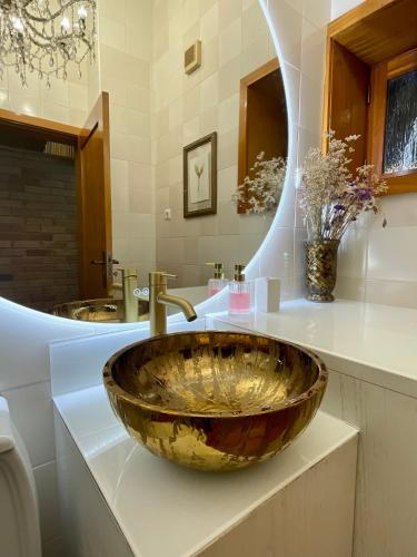 a bathroom with a large bowl sink on a counter at Pedacinho de Mundo Douro in Passinhos de Cima