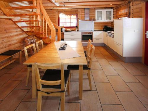 a kitchen with a wooden dining table and chairs at Ferienhaus in Schierke mit Garten in Schierke