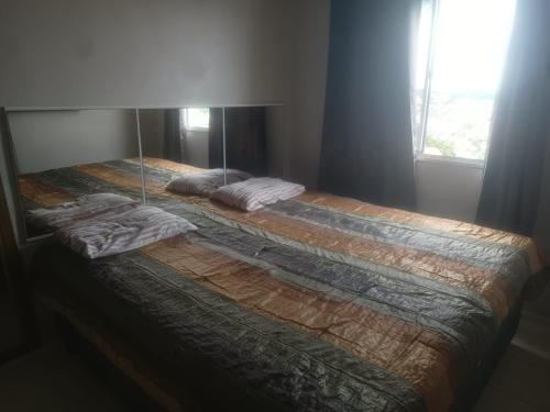 En eller flere senge i et værelse på Condominio Mirante do Lago