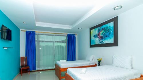Postel nebo postele na pokoji v ubytování Hotel Tortuga Bay - Galápagos