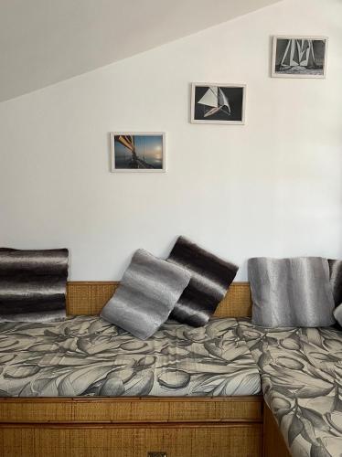 a bedroom with a bed with pillows on it at T V B - Vacanze Imperia in Imperia