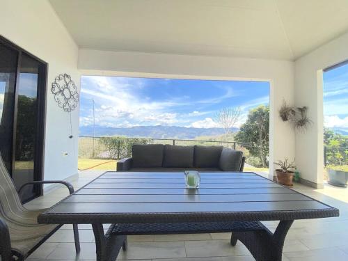 a living room with a table and a couch at Casa Daniela, Relax and Enjoy! in Escobal