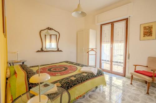 a bedroom with a bed and a glass table at Casa di Nina in Pretoro