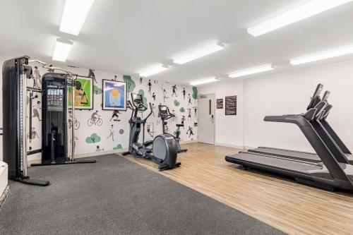 a gym with treadmills and ellipticals in a room at Sonesta Simply Suites Baltimore BWI Airport in Linthicum Heights