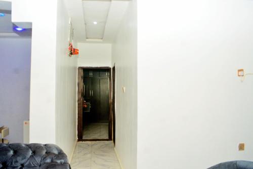a hallway with a door leading into a room at Ike Service Apartments in Owerri