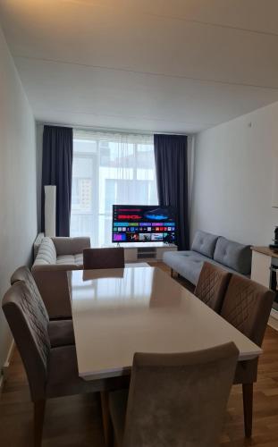 a living room with a couch and a table at Two storey apart Most beautiful location in Copenhagen in Copenhagen