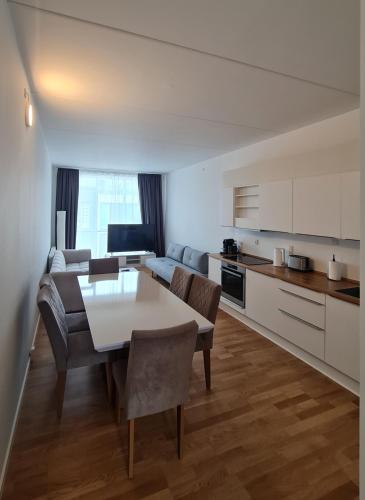 a kitchen and living room with a table and chairs at Two storey apart Most beautiful location in Copenhagen in Copenhagen