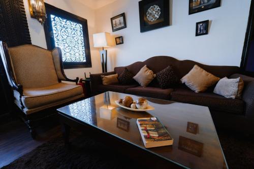 a living room with a couch and a coffee table at Saphir Dahabiya luxury sailing boat Nile cruise Every Saturday from Luxor 4 or 7 nights in Luxor