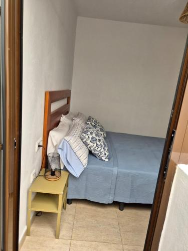 Ένα ή περισσότερα κρεβάτια σε δωμάτιο στο Apartamentos Cotillo Family