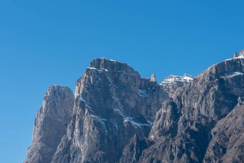 a mountain view with a blue sky in the background at Casa Adriana in Agordo