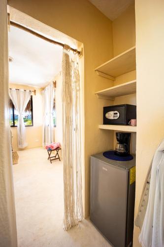 Ein Bett oder Betten in einem Zimmer der Unterkunft Atenea Holbox