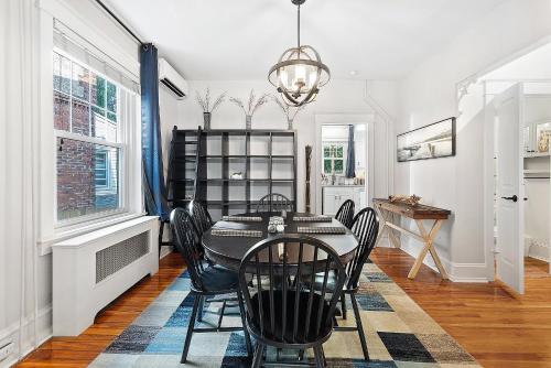 a dining room with a table and chairs at Main Line Manor 3BR with King Beds & Patio & Backyard in Bryn Mawr