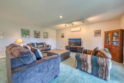 a living room with two couches and a table at Marble Canyon in Fairmont Hot Springs