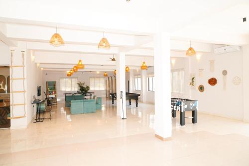 a large room with white walls and white floors at Voyage Zo Lonavala in Lonavala