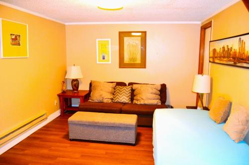a living room with a couch and a table at Urban Oasis in Grand Forks