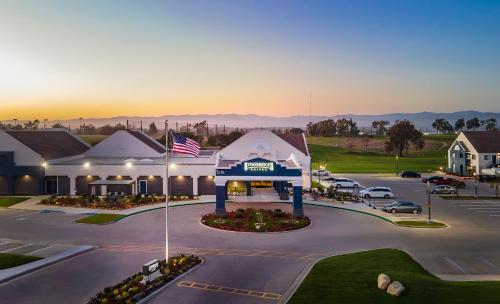 an aerial view of a building with a parking lot at Staybridge Suites Oxnard - River Ridge by IHG in Oxnard