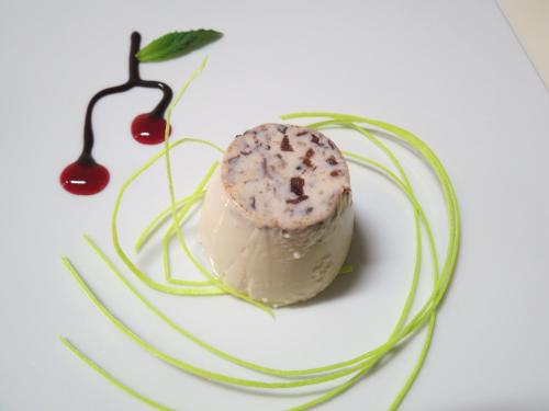 a white plate with a piece of food on it at Villa Morissolina in Trarego