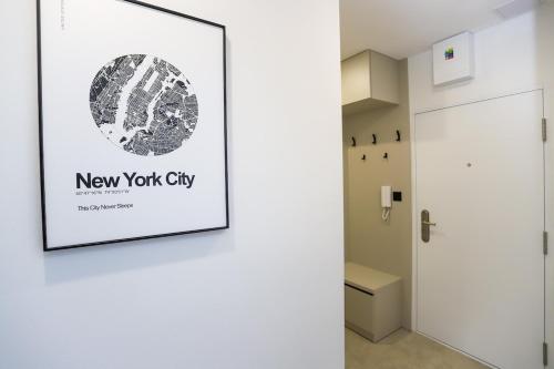 a hallway with a new york city poster on the wall at Moderný apartmán Považská Bystrica - Centrum in Považská Bystrica