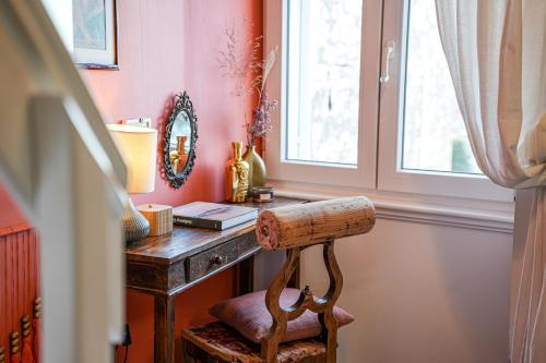 a room with a desk with a chair and a window at Loreto LYA SEA VIEW APARTMENTS in Rovinj