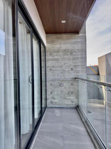 an empty walkway in a building with glass doors at Downtown Tijuana 1 BR Ave Revolucion Suite 1st floor in Tijuana