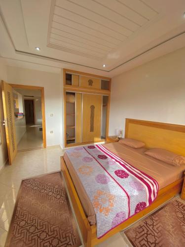a bedroom with a large bed in a room at Dar Assalam in Oualidia