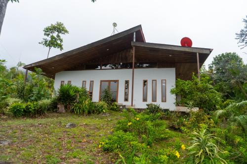 a house on the side of a hill at Talamanca Nature Reserve in Rivas